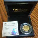 Золотая монета 50 рублей 2014 года.  Олимпийские игра Сочи.  Кёрлинг